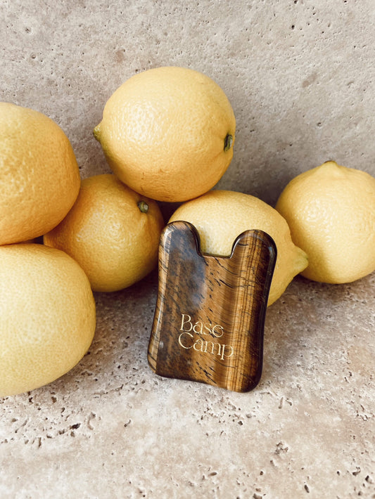 Base Camp Beauty Gua Sha facial tool for a self-care ritual.