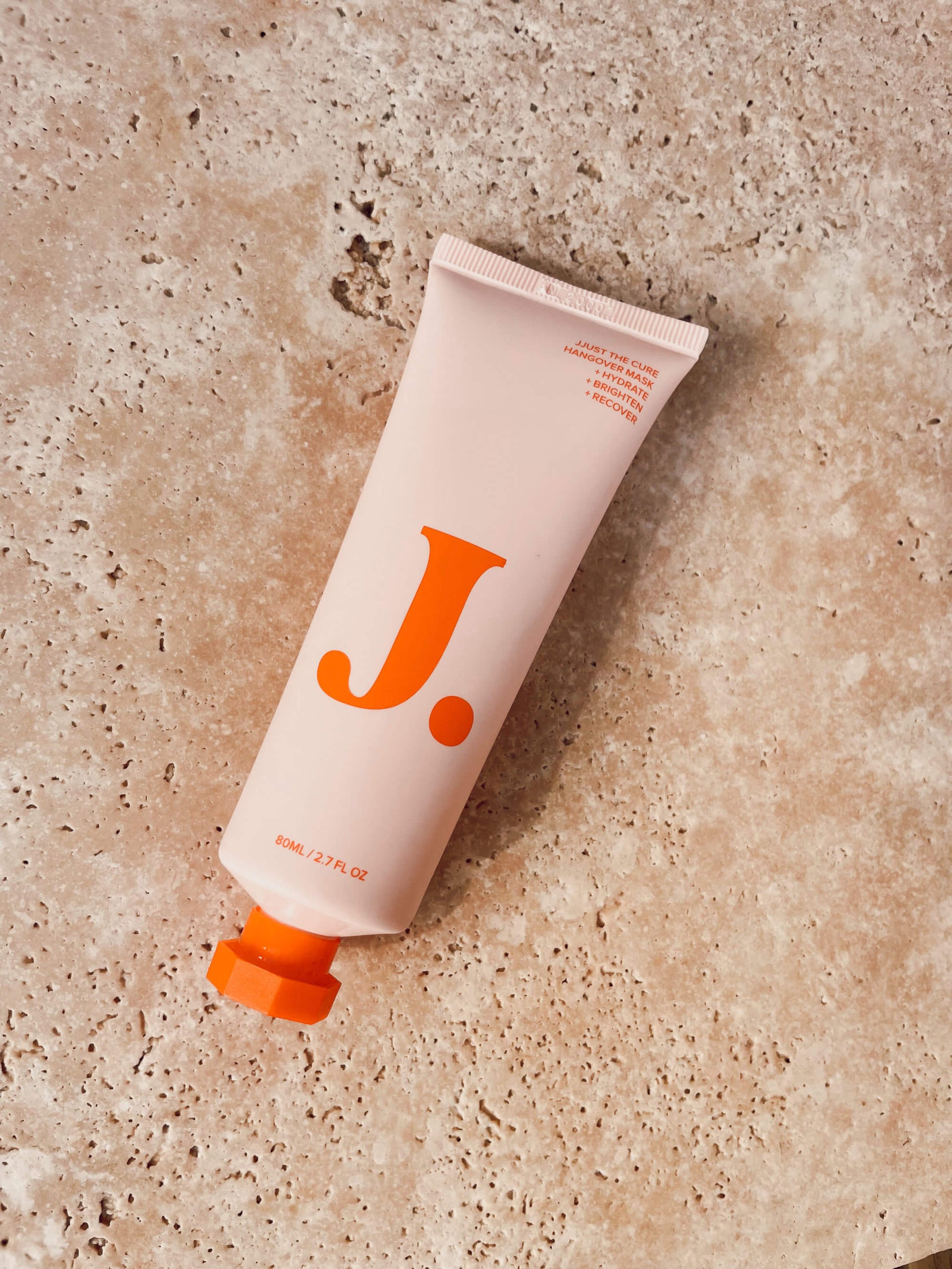 Jjust Hangover Face Mask on a stone benchtop.