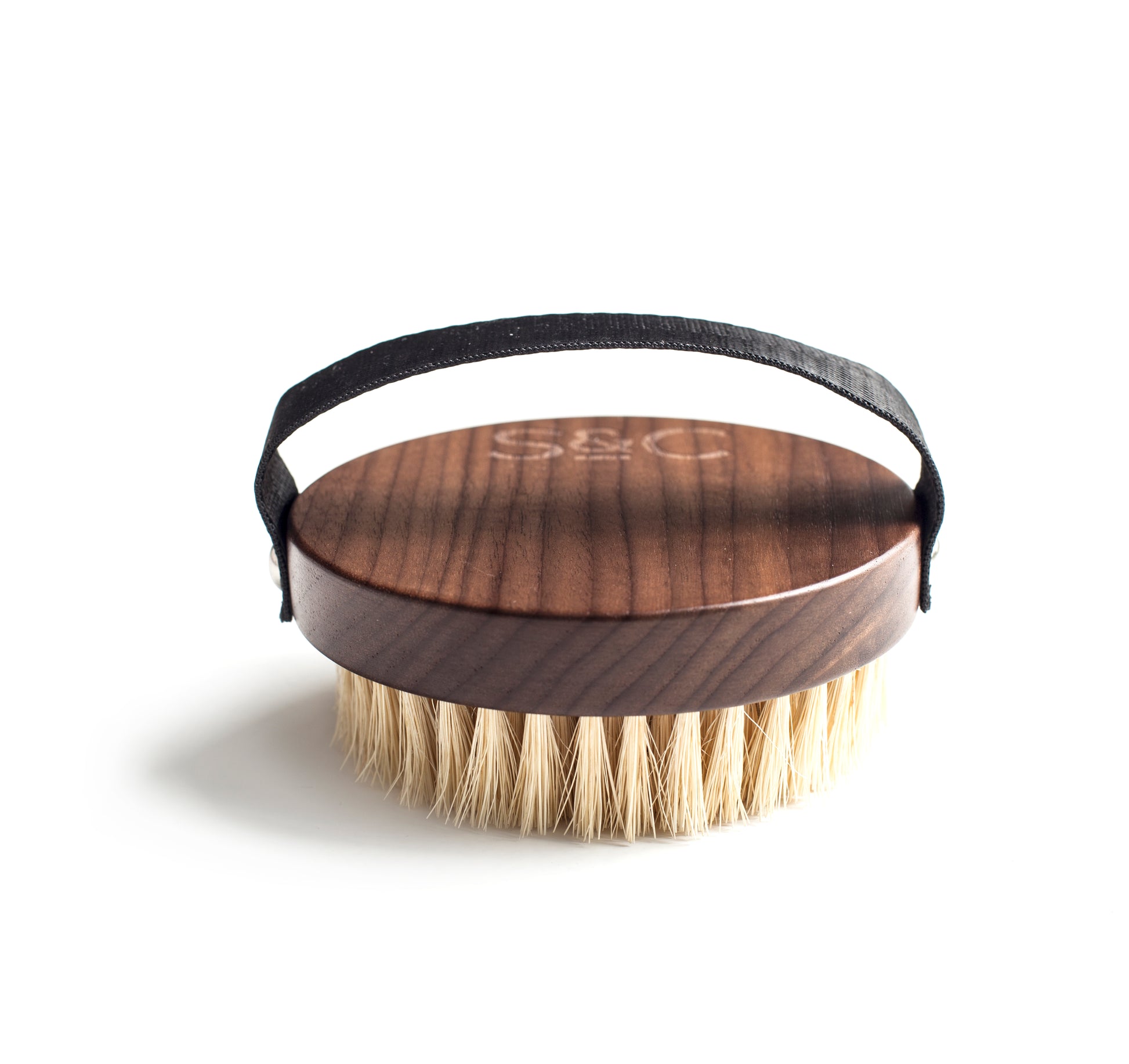 Close up of the dry body brush on a white background.